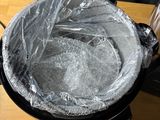 a plastic bag in the bottom of a pot on a table