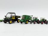 a lot of toy tractors that are lined up together