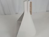 a white vase sitting on a table with a tag on it