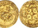 a gold coin with an image of a man on a horse