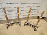 two luggage carts sitting next to each other on the floor