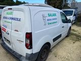 a white van that is parked in a lot