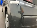 a close up of a car with a sticker on it ' s bumper