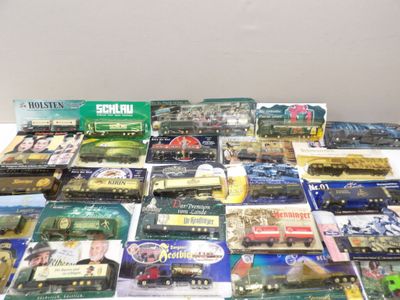 many different types of toy trains sitting on a table