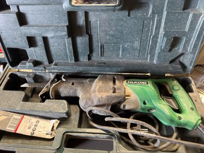 a tool box with tools in it sitting on a table