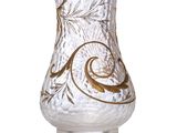 a clear glass vase with a gold design on it
