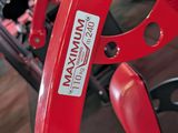 a close up of a red bicycle with a handlebar