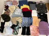 a bed with a lot of clothes and accessories on it