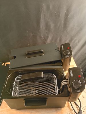 a toaster that is sitting on a wooden table