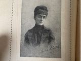 an old book with a picture of a woman on it