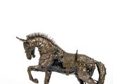 statue of a horse with spikes on its head and tail