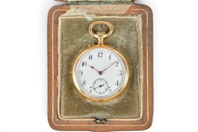 a gold pocket watch in a case on a white background