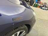 a close up of a car with a sticker on it