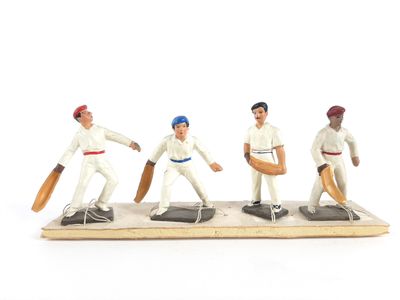 figurines représentant un groupe d'hommes jouant au cricket