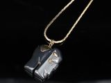an image of a necklace with a horse on it ' s back