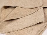 a close up of a pile of towels on a white surface