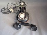 two old telephones that are sitting on a table