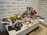 a table with a lot of tools on it in front of a wall