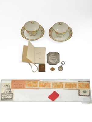 two cups and saucers and a book on the table