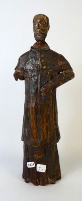 Statuette en bois sculpté figurant un saint personnage.