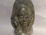 statue of a woman holding a baby in her arms