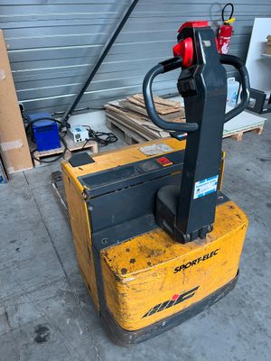 a forklift that is sitting in a garage