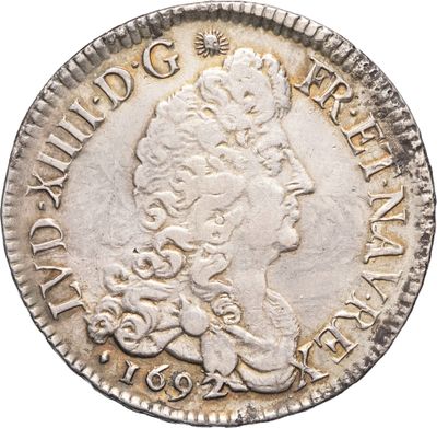 une pièce d'argent sur laquelle est représentée la tête d'une femme