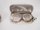 a silver case that has two silver objects inside of it