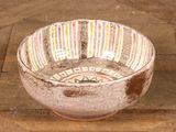 a bowl that is sitting on a wooden table
