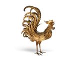 figurine représentant un coq doré sur fond blanc, avec un fond blanc