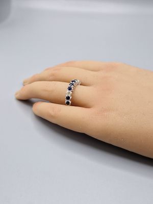 a close up of a person ' s hand with a ring on it