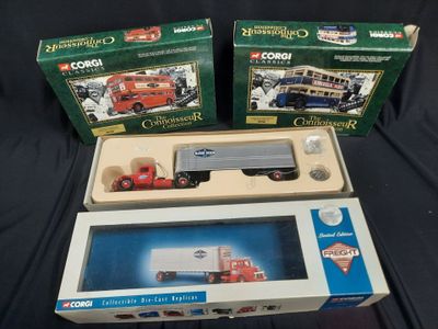three boxed boxed toys of a truck and a bus on a black surface