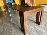 a wooden table with a basket on top of it