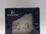 a box with a pair of earrings inside of it