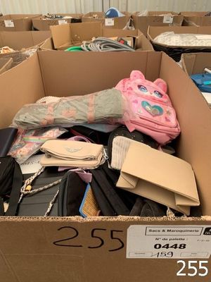 a cardboard box filled with assorted items in a room
