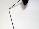 a black lamp that is on top of a table