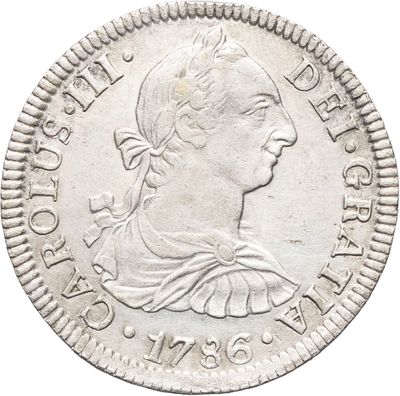 gros plan d'une pièce de monnaie sur fond blanc
