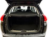the back end of a car with the trunk open and the seats down