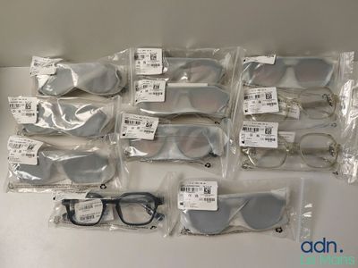 many pairs of glasses that are on the table