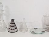 a lot of glass items sitting on a white table