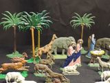 many figurines of animals that are on a table