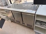 stainless steel refridgerator on display at a store in a mall