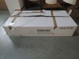 a box that is sitting on the floor in front of a lamp