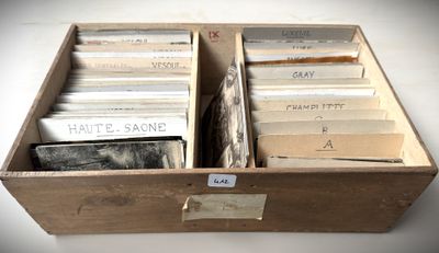 a wooden box filled with old records on a table