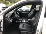 the interior of a white car with black leather seats and a center console