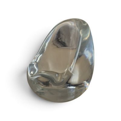 a glass object that is sitting on a white surface