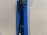 a close up of a black microphone on top of a blue package