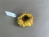 a gold ring with a tag attached to it