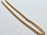 a gold chain bracelet with a clasp on a white background