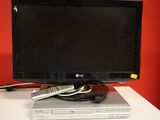 a flat screen tv sitting on top of a dvd player